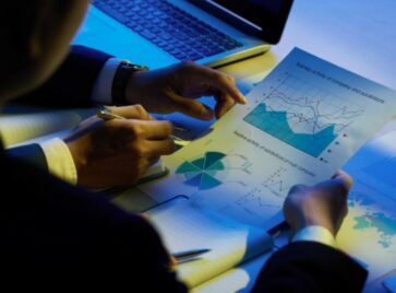 Business professionals analyzing reports highlighting data blind spots in performance and decision making