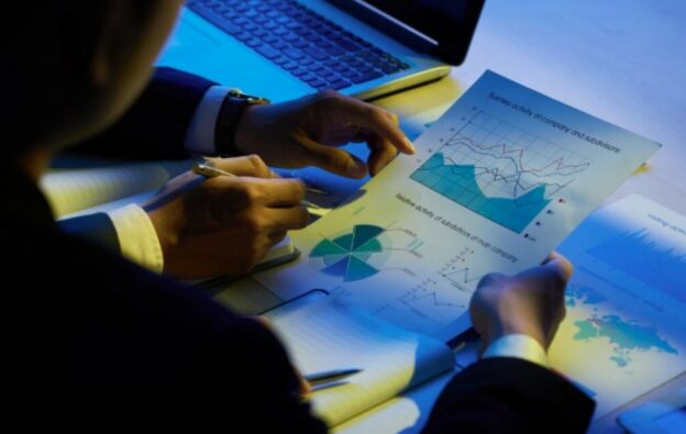 Business professionals analyzing reports highlighting data blind spots in performance and decision making
