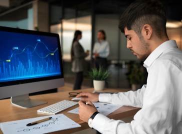 Analyst reviewing dashboard metrics illustrating B2B data quality dimensions in modern data-driven decision making