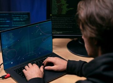 Developer analyzing system code highlighting structural data architecture risk in complex data environments