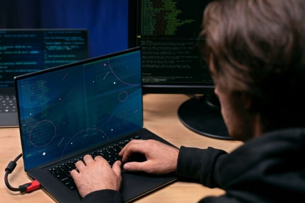Developer analyzing system code highlighting structural data architecture risk in complex data environments