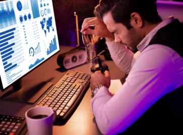 Professional reviewing analytics dashboard highlighting the importance of B2B data freshness in decision-making