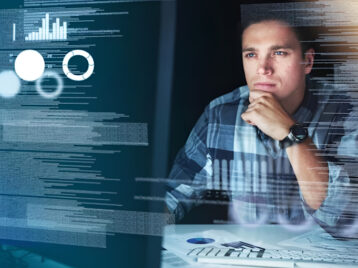Professional analyzing dashboards and system data illustrating challenges in data scalability architecture as data volumes increase