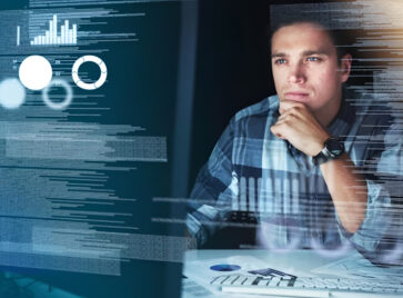 Professional analyzing dashboards and system data illustrating challenges in data scalability architecture as data volumes increase