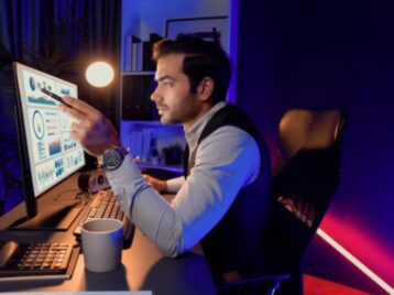 Business analyst reviewing performance dashboards to address the GTM data latency problem and improve decision-making speed
