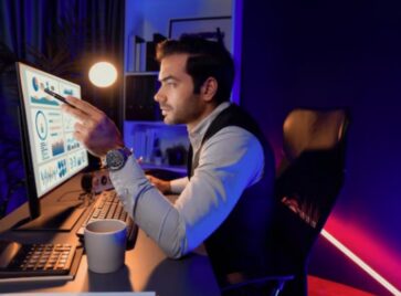 Business analyst reviewing performance dashboards to address the GTM data latency problem and improve decision-making speed