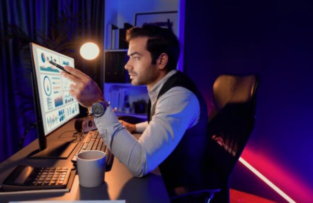 Business analyst reviewing performance dashboards to address the GTM data latency problem and improve decision-making speed